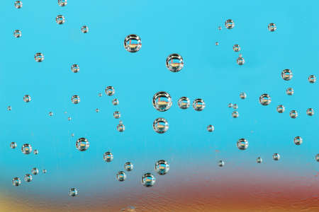 Texture of  abstract  air bubbles in water on blue and red  backroud