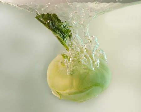 Vegetable German turnip in water splash on white backgroundの写真素材