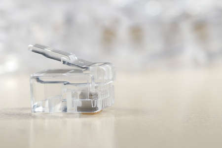 Close up of Transparent ethernet internet rj-45 connector on white
