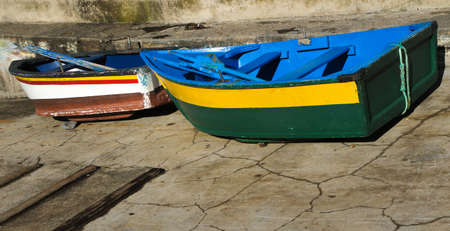 Two colorful wooden boats in Camara de Lobos vilage Madeira island Portugalの写真素材