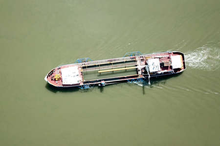 Top view of old cargo shep in the river