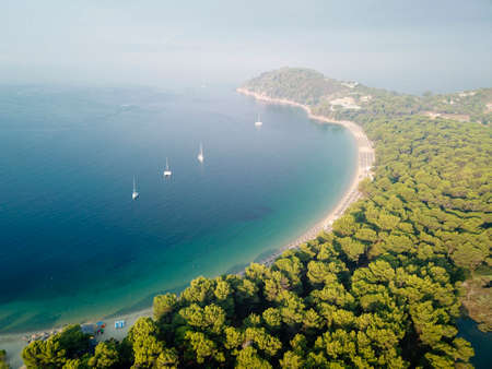 Koukounaries beach at Skiathos and four sailboatsの写真素材