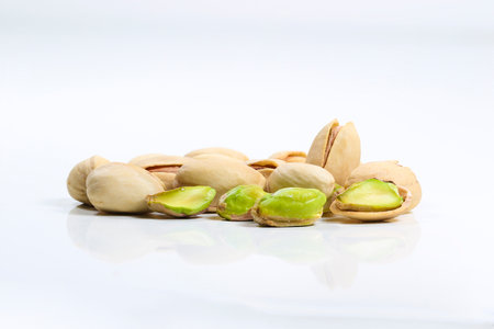 Close up of roasted pistachio nut  isolated on the white backgroundの写真素材