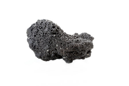 Unpolished black raw pumice rock cutout. Isolated over white backround.の写真素材