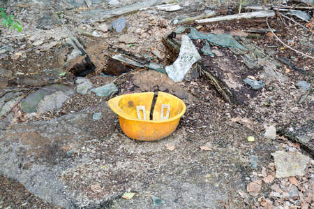 Broken safety helmet and glass pieces.の写真素材