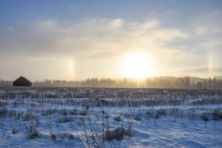 Field and snow. Halo effect.の写真素材