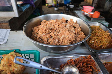Fried pork at street food in Phuket, Thailand.の写真素材