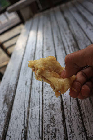 Deep fried dough stick on wooden table in the morning, Thailand.