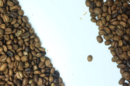 Coffee beans on white background. Close up of roasted coffee beans.の写真素材