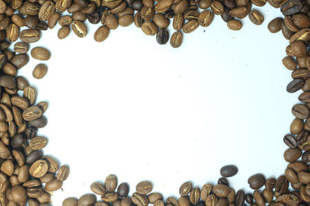 Coffee beans on a white background. Space for text.の写真素材