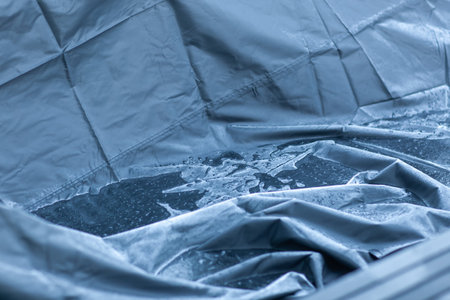 puddle after rain on car coverの写真素材