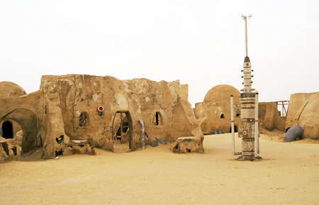 Abandoned sets for the shooting of the movie Star Wars in the Sahara desert on a background of sand dunes.のeditorial素材