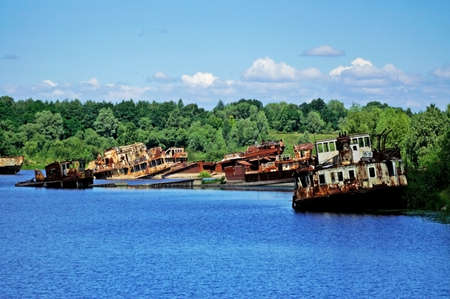 Old rusty ships in the river near Chernobylの写真素材