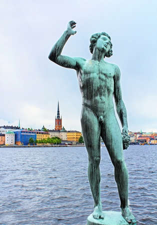 Song statues with Stockholm Town Hall in the background, Stockholm, Swedenの写真素材