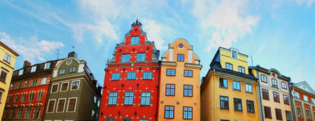 Red and Yellow iconic buildings on Stortorget, a small public square in Gamla Stan, the old town in central Stockholm, Swedenの写真素材