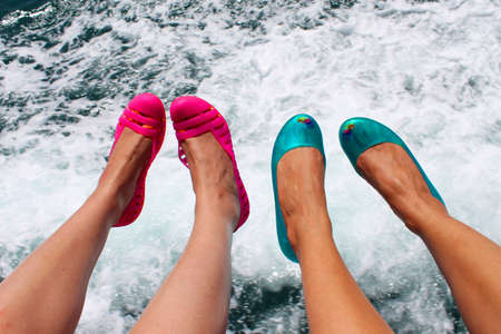 Female legs on water backgroundの写真素材