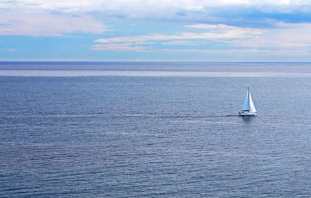 Sailing boat on the sea and blue sky