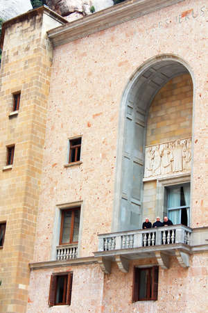 Monks are on balcony in Montserrat Benedictine monastery, religious center of Catalonia, Montserrat, Spain  Monks rarely appear in public  The monastery is 48 kilometres  30 mi  west of Barcelona, and can be reached by road, train or cable carのeditorial素材
