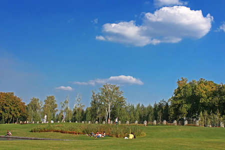 Mezhyhirya - former private residence of ex-president Yanukovich, now open to the public, Kyiv region, Ukraine. Unidentified people are resting on the golf field.のeditorial素材