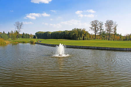 Mezhyhirya - former private residence of ex-president Yanukovich, now open to the public, Kyiv region, Ukraine. Pond on the golf field.のeditorial素材