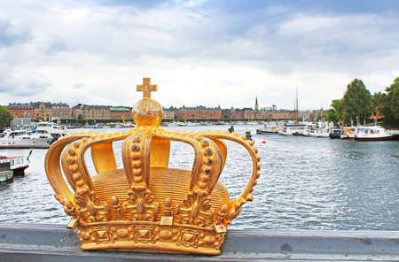 Golden crown detail on bridge in Stockholm, Sweden