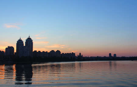 Obolon skyline near the Dniepro river in Kyiv. It is sunset timeの写真素材