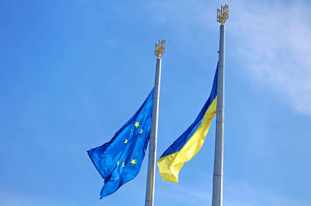 Flags of the EU and Ukraine on the flagpole