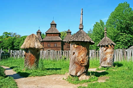 Antique wooden chapel and beehive, Pirogovo, Kyiv, Ukraineのeditorial素材