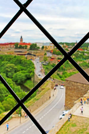 Blurred view of Kamianets-Podilskyi city from the castle through the lattice, Ukraineの写真素材