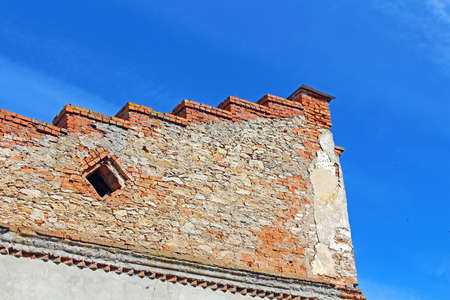 Wall over blue sky in Medzhybizh, Ukraine. Medzhybizh Castle, built as a bulwark against Ottoman expansion in the 1540s, became one of the strongest fortresses of the Crown of the Kingdom of Poland in Podolia. It is situated at the confluence of the Southのeditorial素材