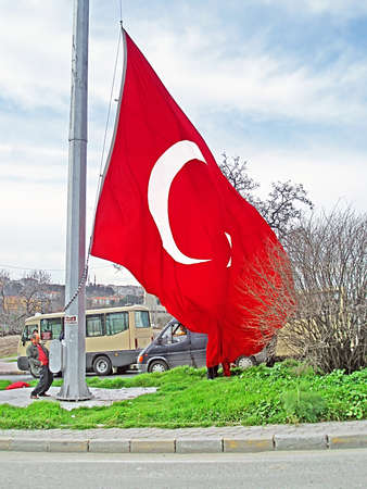 Unidentified man raises the Turkey flag, Istanbul, Turkeyのeditorial素材