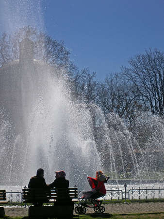 Young married couple with child resting near Hagia Sophia and fountain, Istanbul, Turkeyのeditorial素材