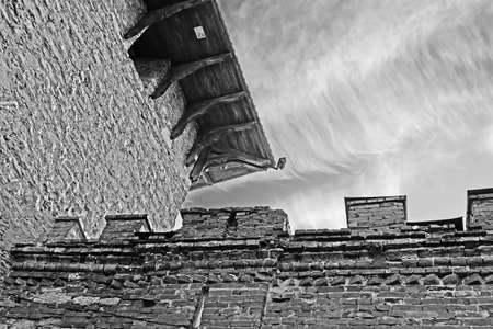 Top view of tower of Medzhybizh castle, Ukraine. Medzhybizh Castle, built as a bulwark against Ottoman expansion in the 1540s. Today the castle is part of the State Historical-Cultural Preserve. Black and whiteのeditorial素材
