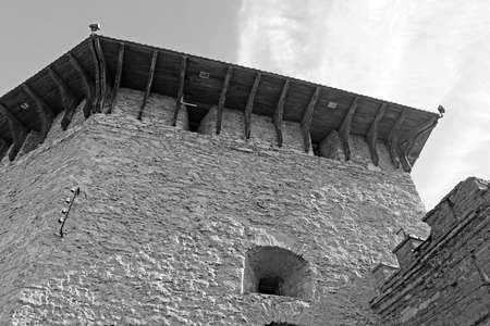 Top view of tower of Medzhybizh castle, Ukraine. Medzhybizh Castle, built as a bulwark against Ottoman expansion in the 1540s. Today the castle is part of the State Historical-Cultural Preserve. Black and whiteのeditorial素材