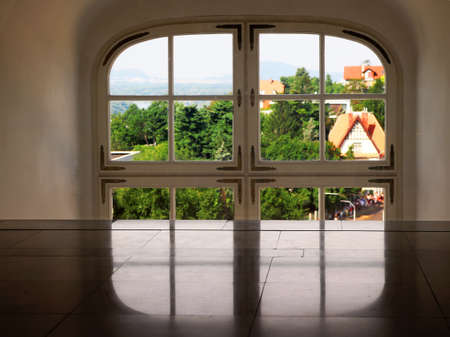 Window view of Bratislava, Slovakia. Part of the window, reflection of the window on the floor