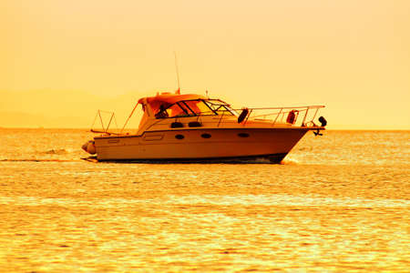 Yacht in the Mediterranean at sunset. Golden hoursの写真素材