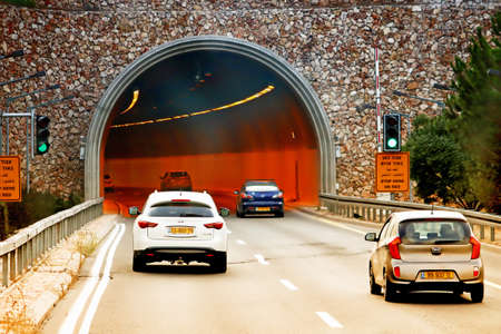 ISRAEL - SEPTEMBER 20, 2017: Cars enter mount highway tunnel on the way to Jerusalem road number 1のeditorial素材
