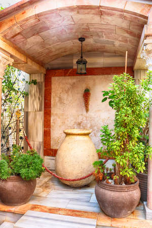 Wine bowl and clay pots with plants near the Cana greek orthodox wedding church in Cana of Galilee, Kfar Kana, Israelの写真素材