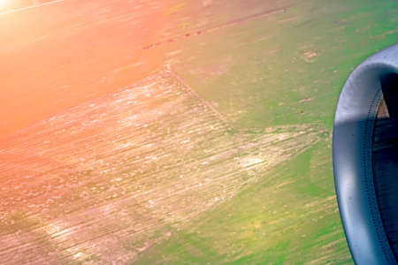 View of an agricultural green field from an airplane in the morning at dawn. Near Bratislava, Slovakiaの写真素材