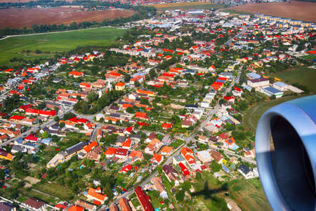 View of the village, agricultural fields from an airplane near Bratislava, Slovakia. Shadow of an airplaneの写真素材