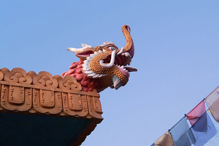 View of dragon head and colour flags near Boudhanath Stupa in Kathmandu, Nepalの写真素材