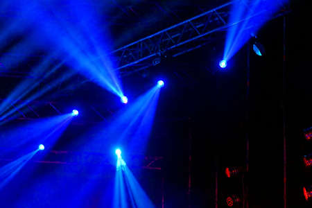 Stage Spotlight with rays. Concert lighting background