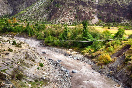 Suspension bridge in Himalayan mountains in Nepal
