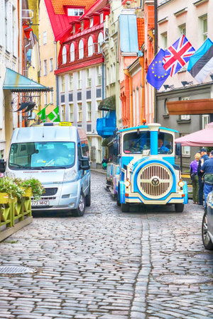 Tallinn, Estonia - August 30, 2018: Blue City Train, tourist sightseeing vehicle, is driven through Rataskaevu Street in the Old Town of Tallinn, UNESCO World Heritage siteのeditorial素材