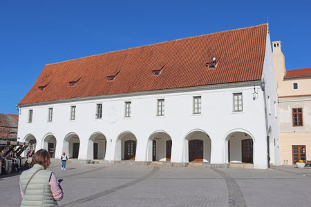 Sibiu, Romania - October 14, 2023: White building on Small Squareのeditorial素材