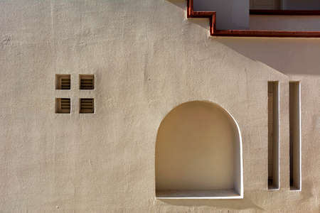 textured wall of the house with shadowsの写真素材