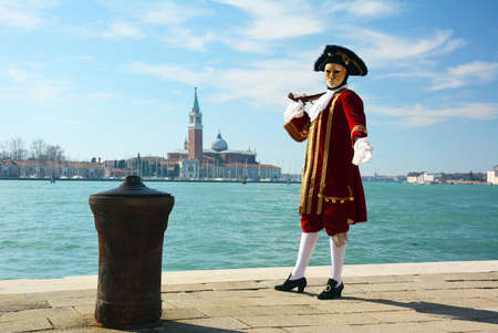 bright and beautiful costumes and masks at the carnival in Veniceのeditorial素材