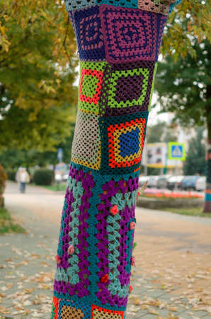 Brest, Belarus - September 19, 2015: Decorated tree trunks colorful designs and symbols texture of the material.の写真素材