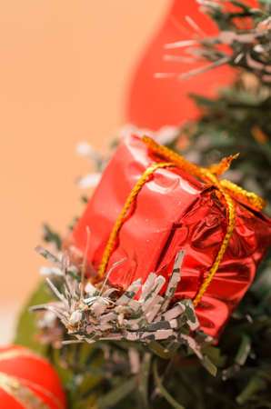 Christmas and New Year gifts in the form of gift boxes and fir-tree toys.の写真素材