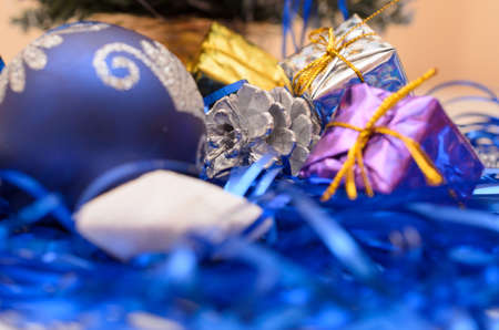 Christmas and New Year gifts in the form of gift boxes and fir-tree toys.の写真素材